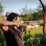 Young archer training with the  bow